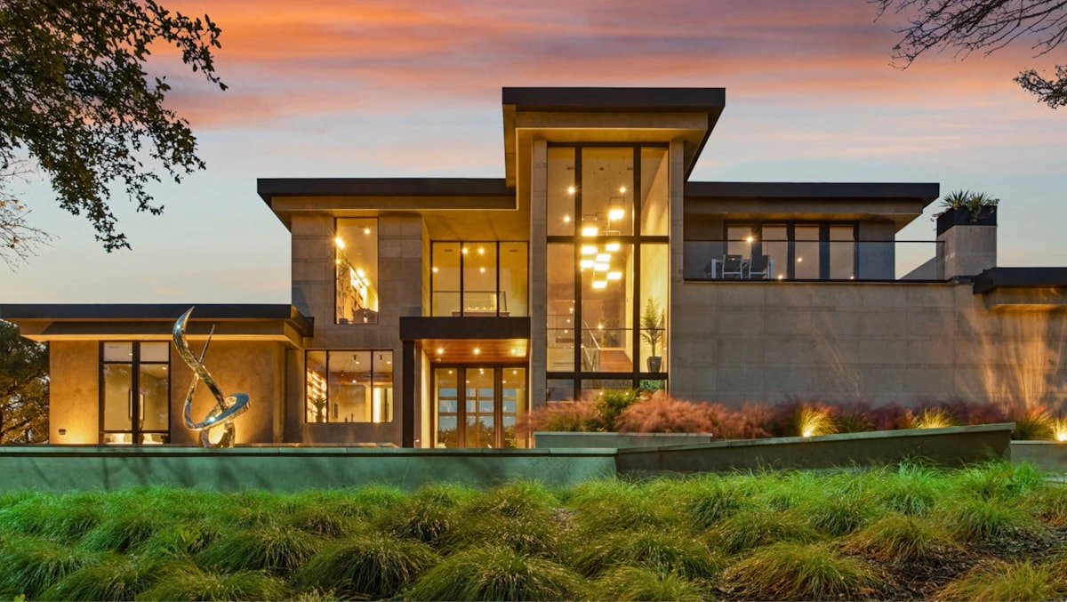 Modern estate exterior at dusk