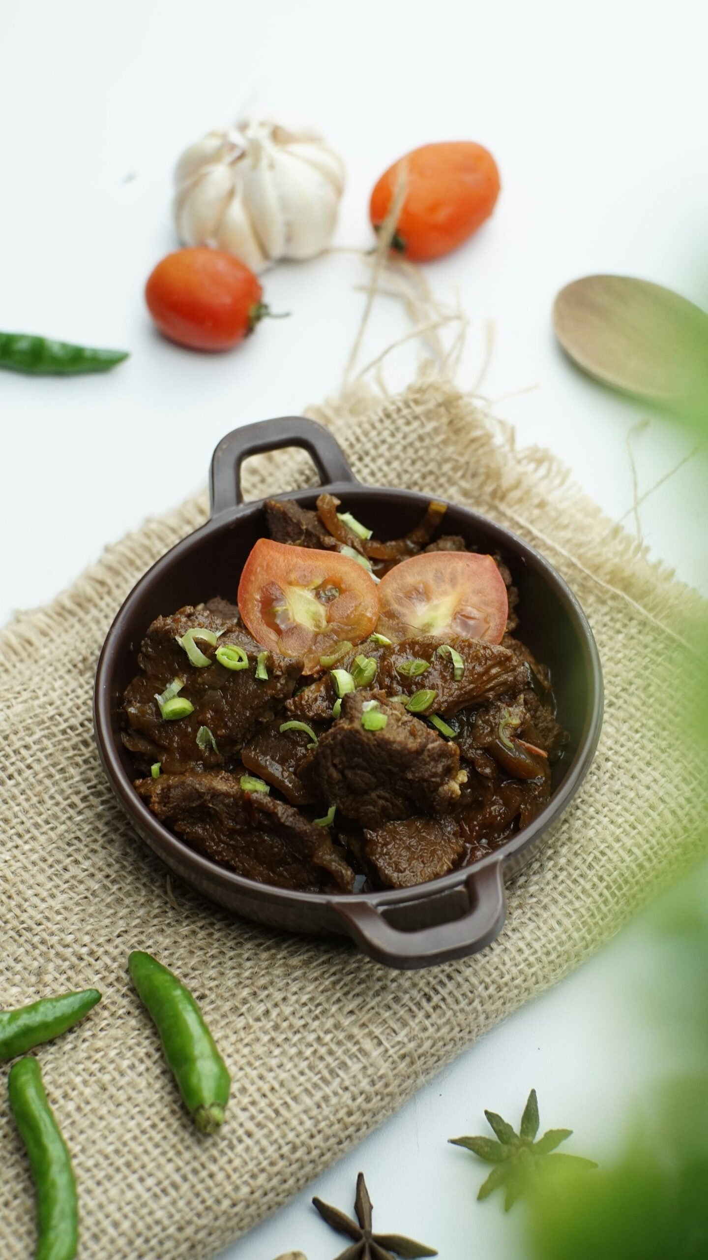 Beef stew served in a brown bowl